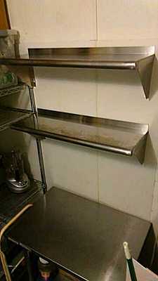Picture of new stainless steel shelves for cafe food prep area